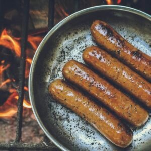 cooked sausage on round grey pan